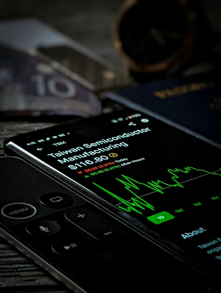 Smartphone with stock market graph showing Taiwan Semiconductor Manufacturing data.